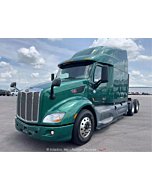 Sleek 2019 Peterbilt 579 sleeper cab semi truck tractor with diesel engine.