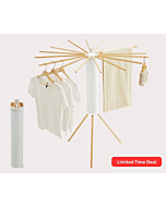 Foldable Tripod Clothes Drying Rack with clothes hanging on it indoors.