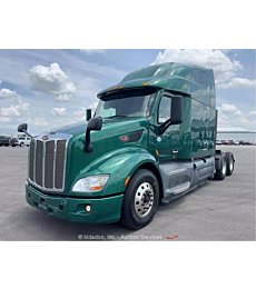 Sleek 2019 Peterbilt 579 sleeper cab semi truck tractor with diesel engine.