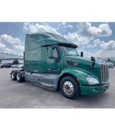 Sleek 2019 Peterbilt 579 sleeper cab semi truck tractor with diesel engine.