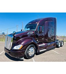 2022 Kenworth T680 purple sleeper cab semi truck tractor