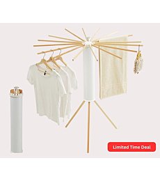 Foldable Tripod Clothes Drying Rack with clothes hanging on it indoors.