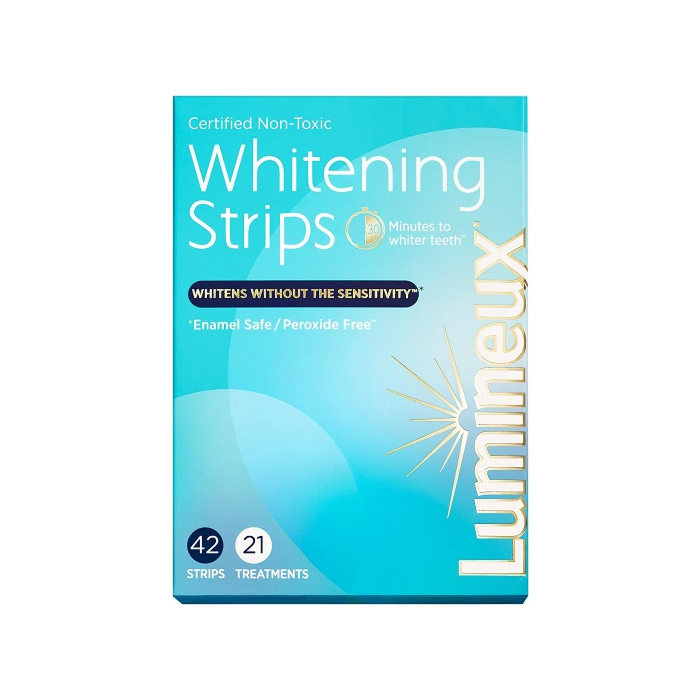 Applying Lumineux Teeth Whitening Strips for a whiter smile. - Anti allergy Teeth Whitening Strips